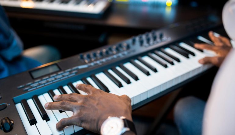 hands-of-young-african-composers-or-musician-touch-YJN5GHX.jpg